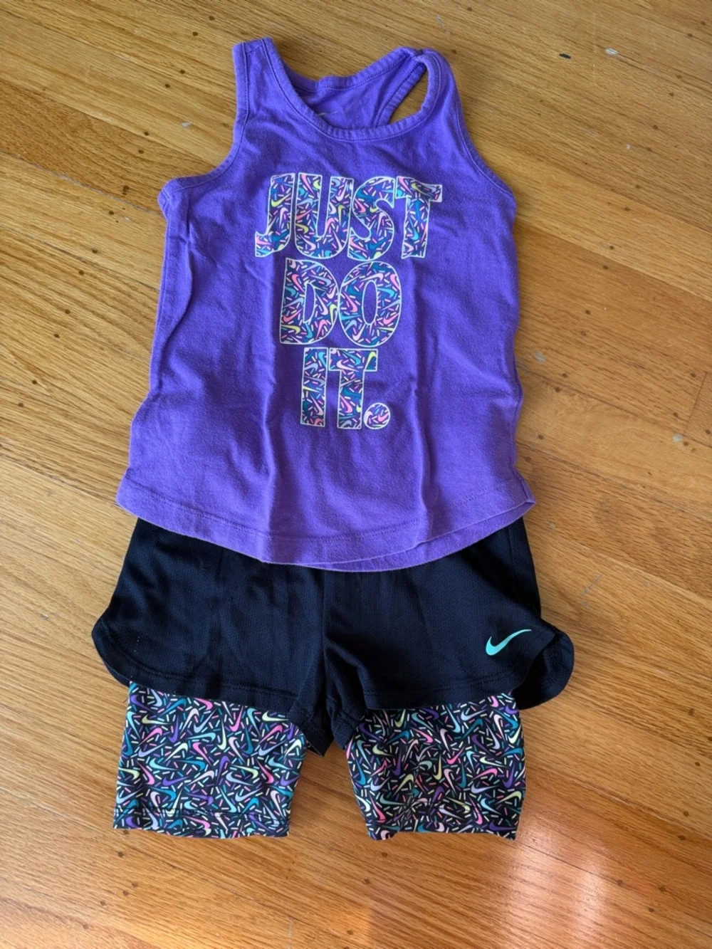 Nike Purple Graphic Tank with Black Shorts and Multicolor Patterned Bike Shorts - Picture 1 of 7